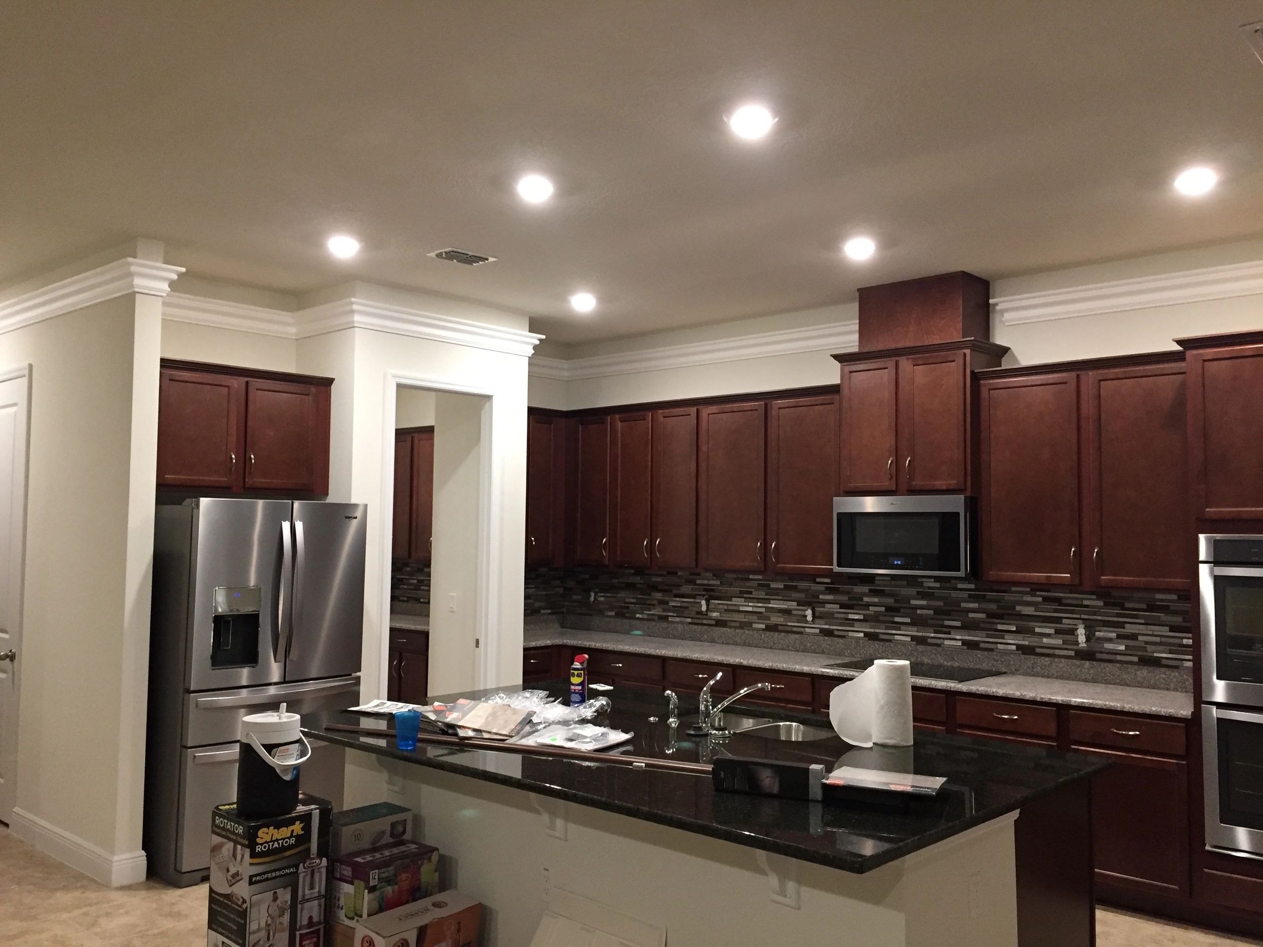 Modern kitchen with dark cherry wood cabinetry